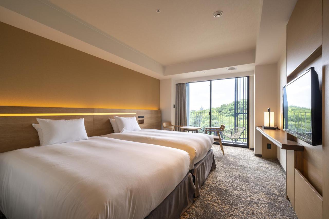 Twin Room with Bathroom, Balcony and Garden View - Non Smoking,1065551386:JPEG