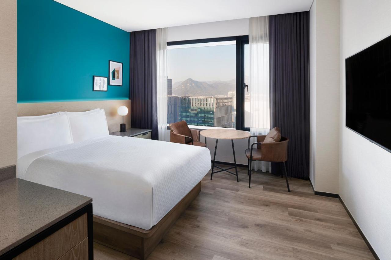 Superior room with a double bed and city view