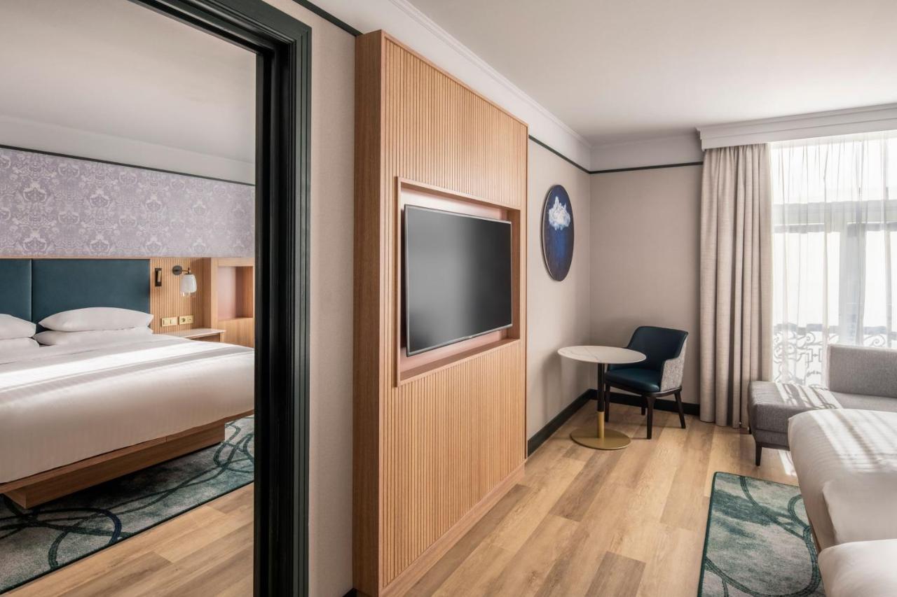 Two-Bedroom Connecting Room with One King and Two Twin Beds