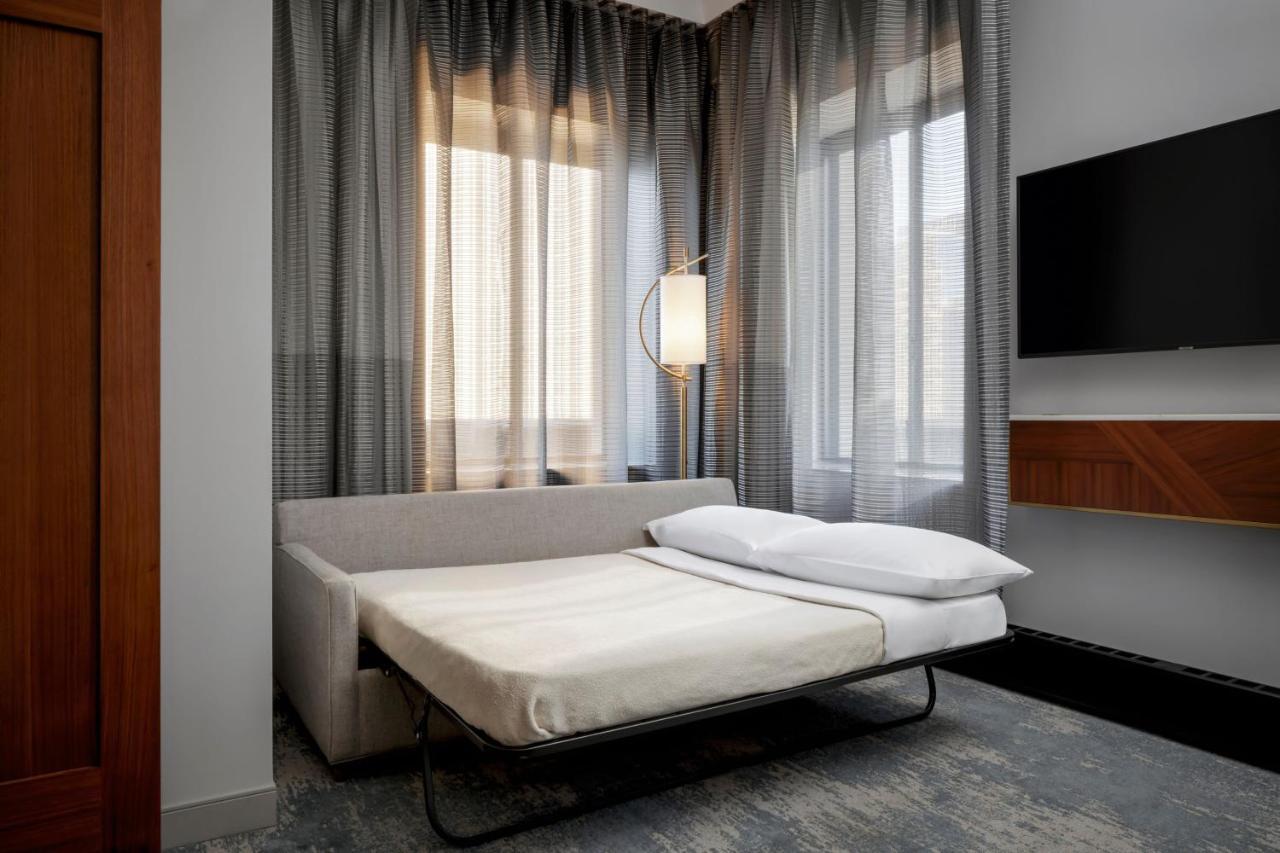 Premier King Suite with Sofa Bed and City View