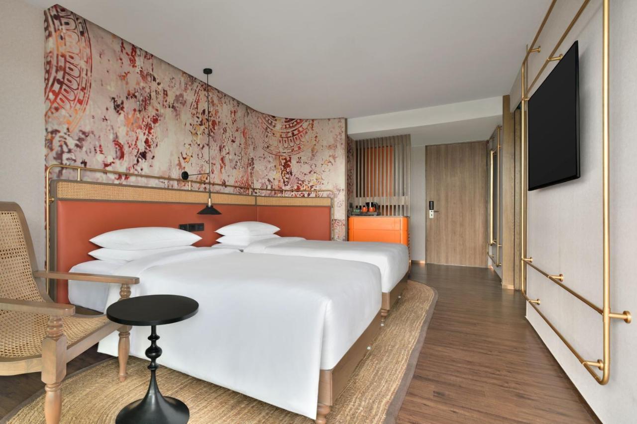 Standard Twin Room with Balcony – Spacious 538 Square Feet Room with Happy Hours from 11 AM to 6.30 PM