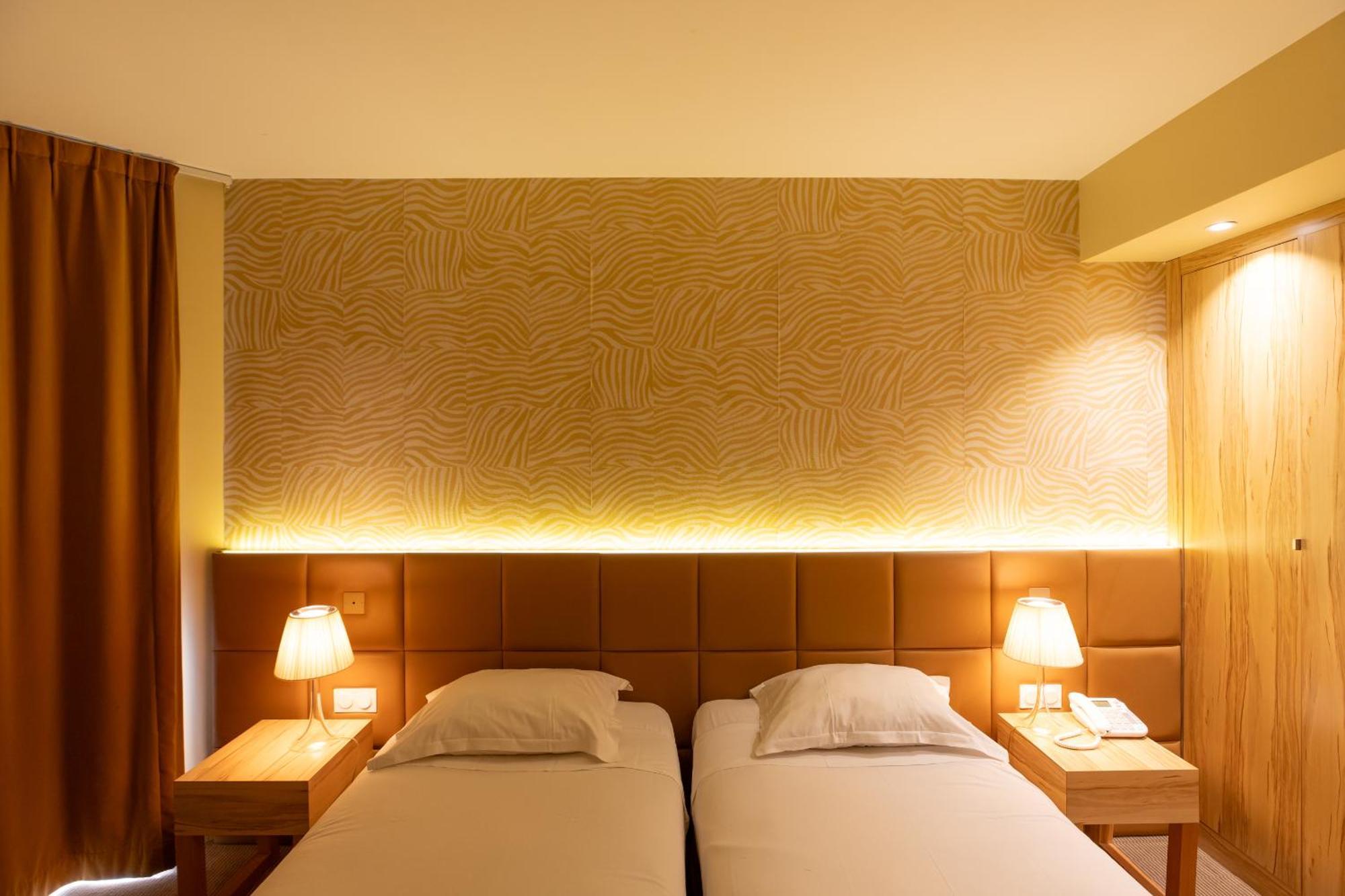 Superior Quadruple Room with One King and Two Single Beds - Private Patio