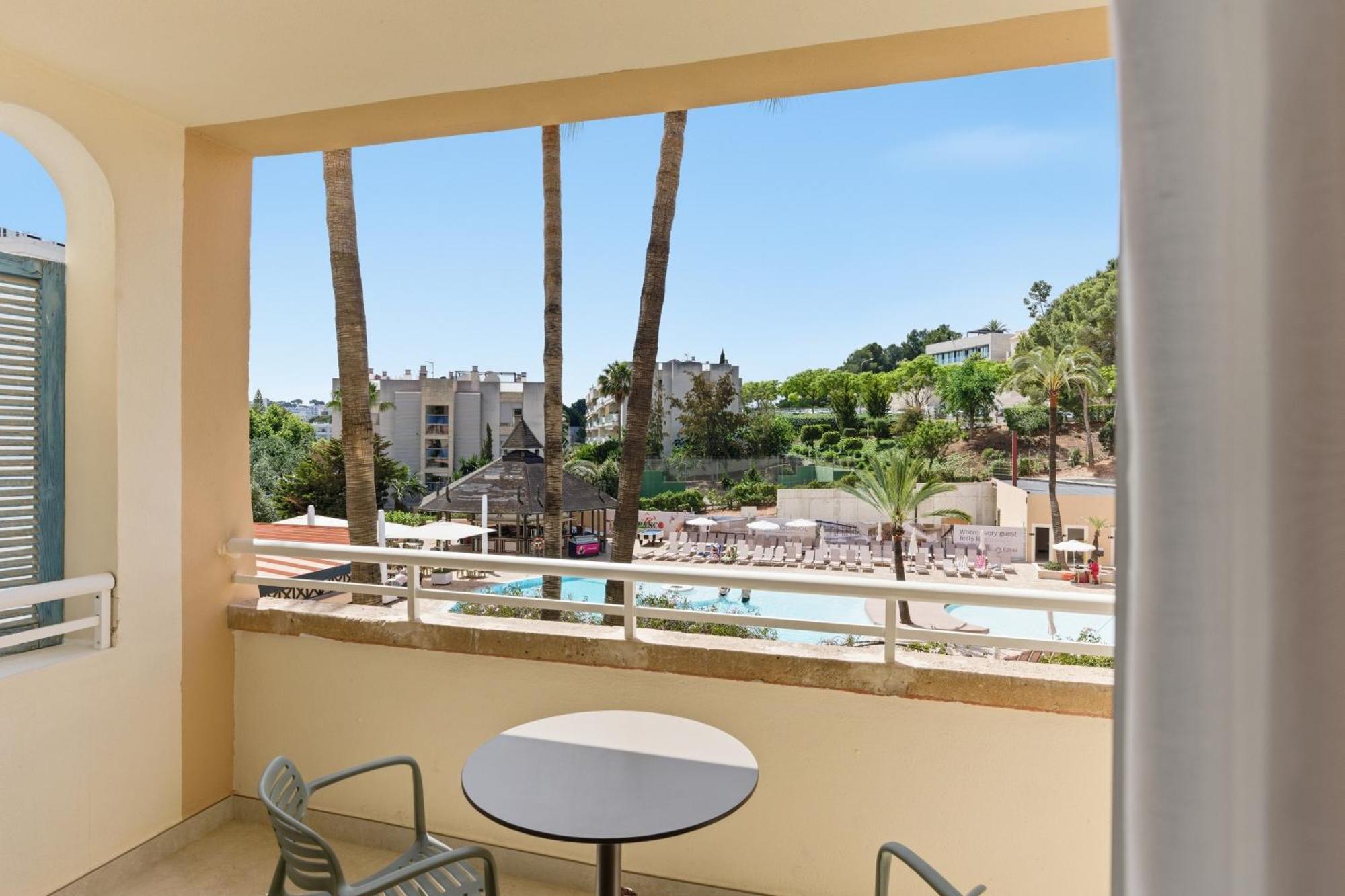 One-Bedroom Apartment with Balcony and Pool View