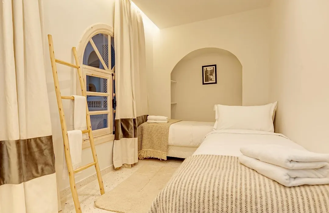 Riad K-White-1